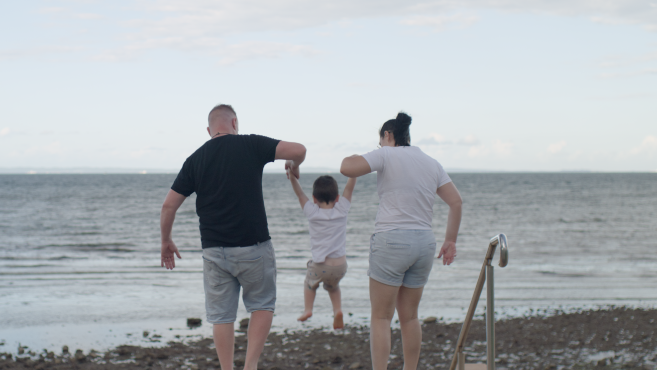 Allan with his family at the beach