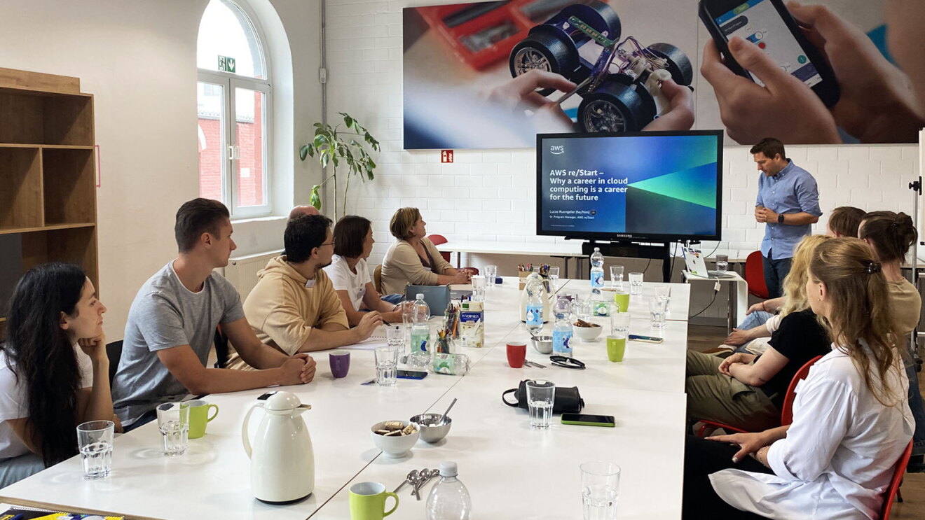 An image of employees in the AWS training programs