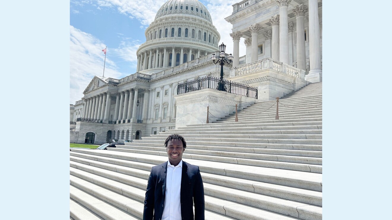 pissi adam an amazon career choice participant stands in the foreground in front of the united states capitol building