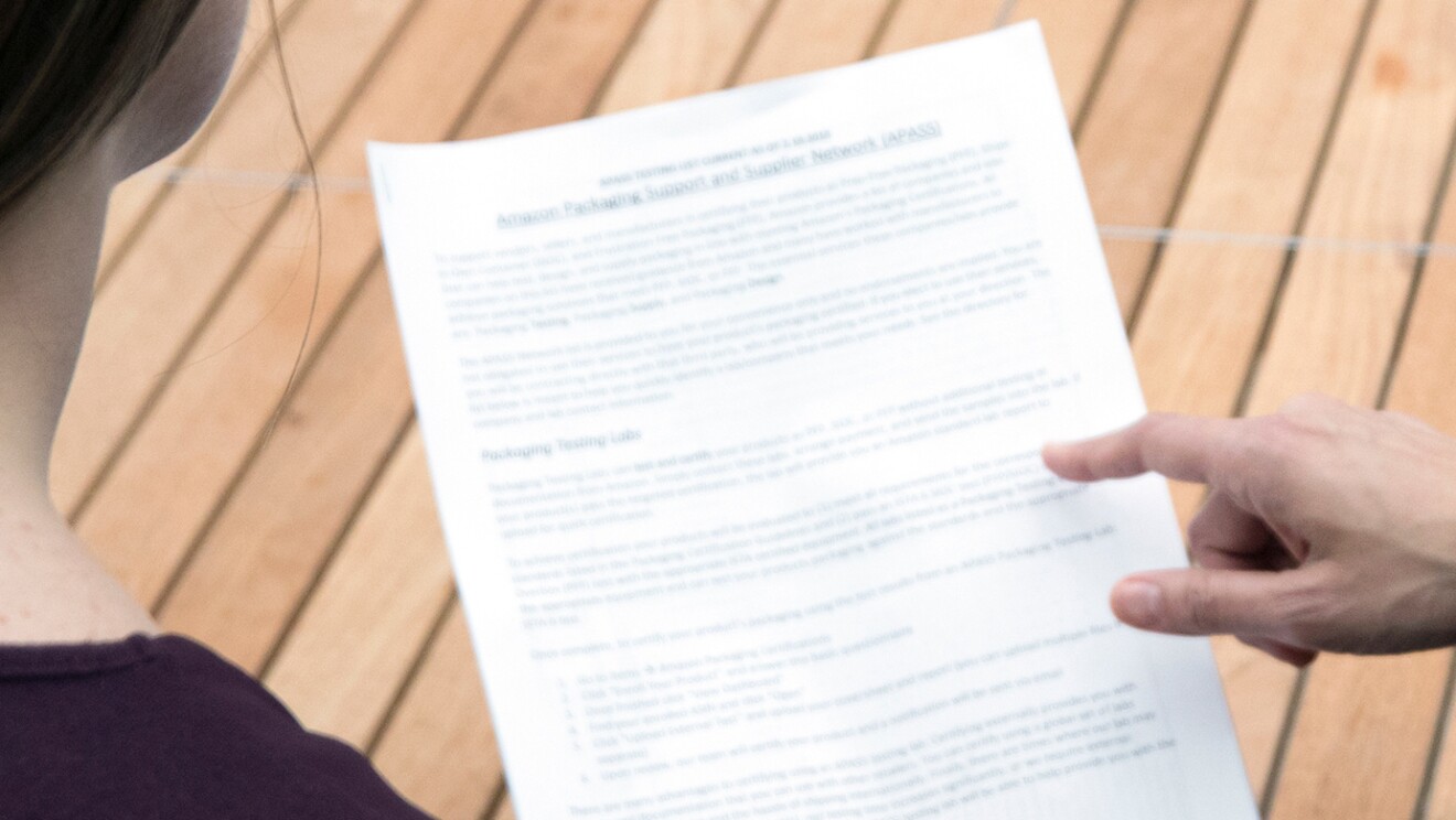 Two people looking at a piece of paper