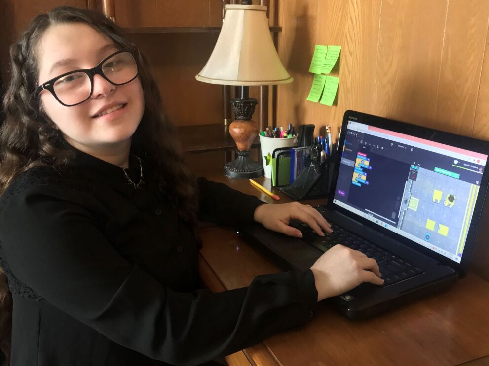 Amazon Future Engineer student learning computer science skills from home.