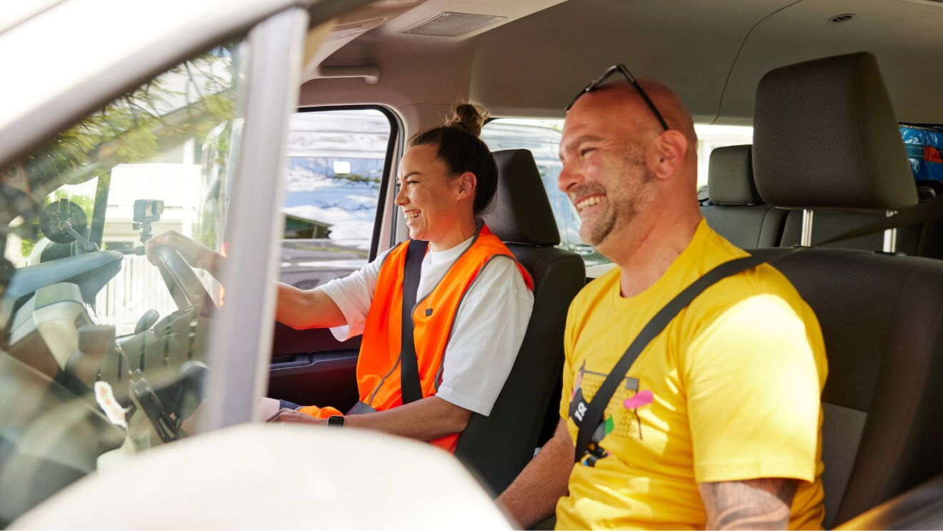 Mackenzie Arnold and Amazon Flex driver Phil Rock in a delivery van.