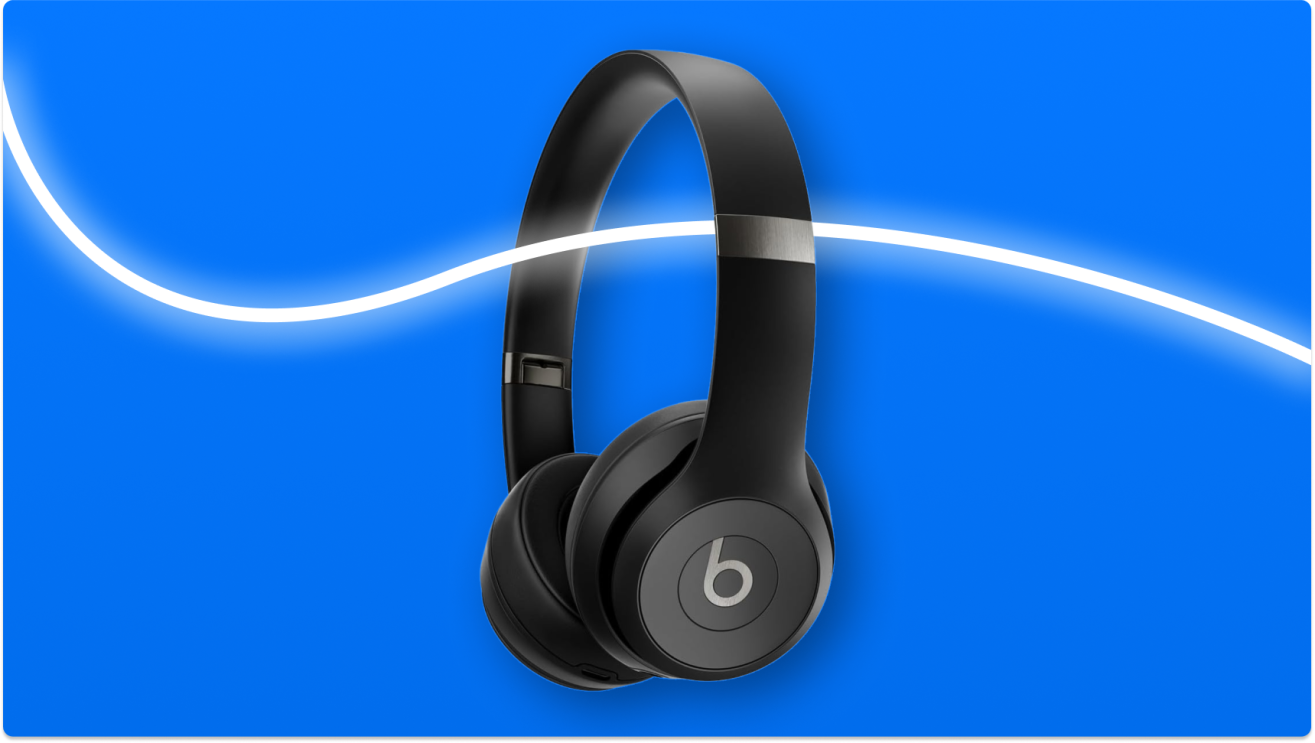 Black Beats headphones against vibrant blue background with white wave