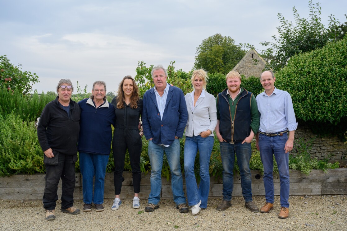 The Diddly Squat Farm team, including Alan Townsend, Gerald Cooper, Annie Gray, Jeremy Clarkson, Lisa Hogan, Kaleb Cooper, Charlie Ireland