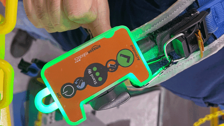 An image of an orange device with buttons on it that allow you to control and activate the vets it's attached to.