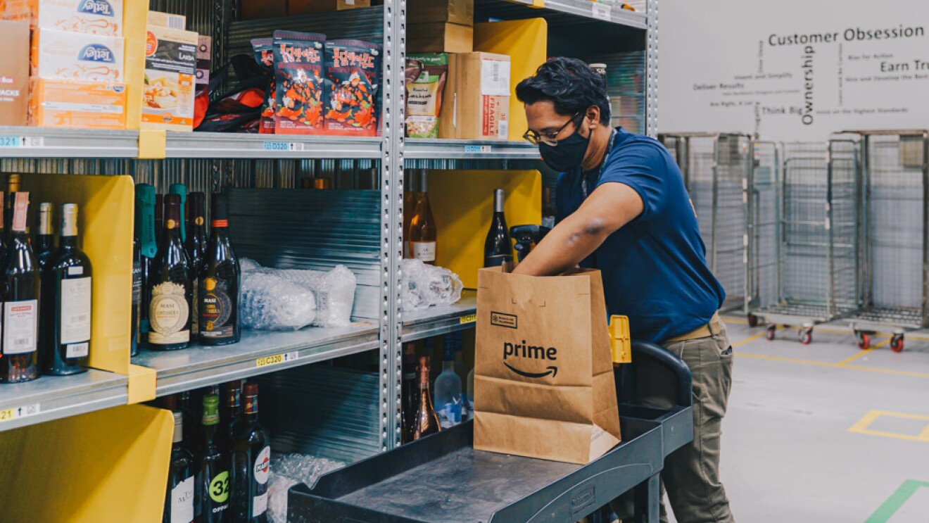 An employee packing an Amazon Fresh order in the fullfilment centre in Singapore