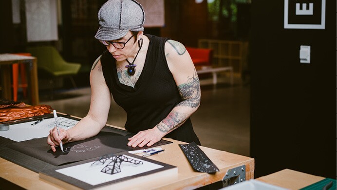 Artist from the Artist in Residence in program work on their respective art.