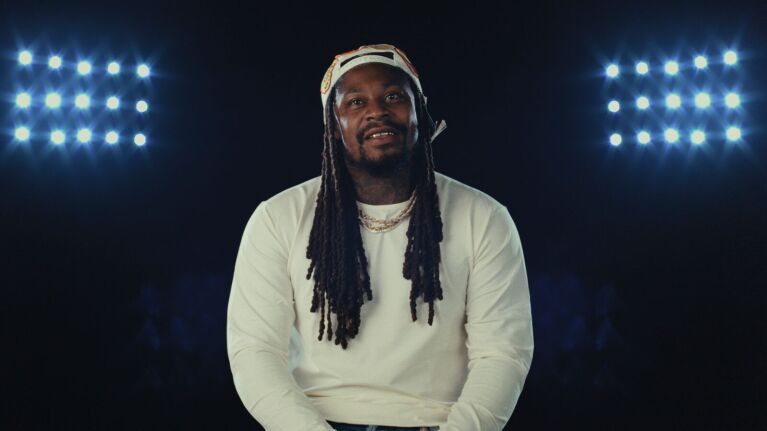 Former NFL running back Marshawn Lynch speaks during interview.