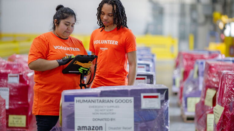 Amazon volunteers sorting humanitarian goods for disaster relief