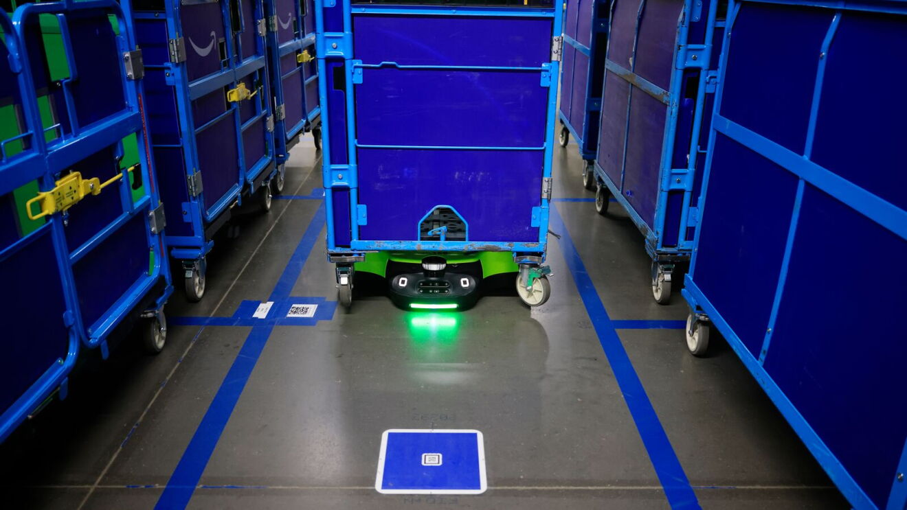 An Amazon robot transporting a cart