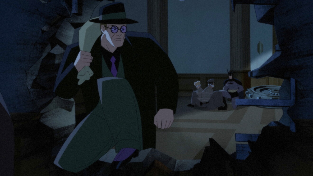Still from Prime Videos' 'Batman: Caped Crusader' Season 2: Person in suit amid destruction and chaos in an office setting