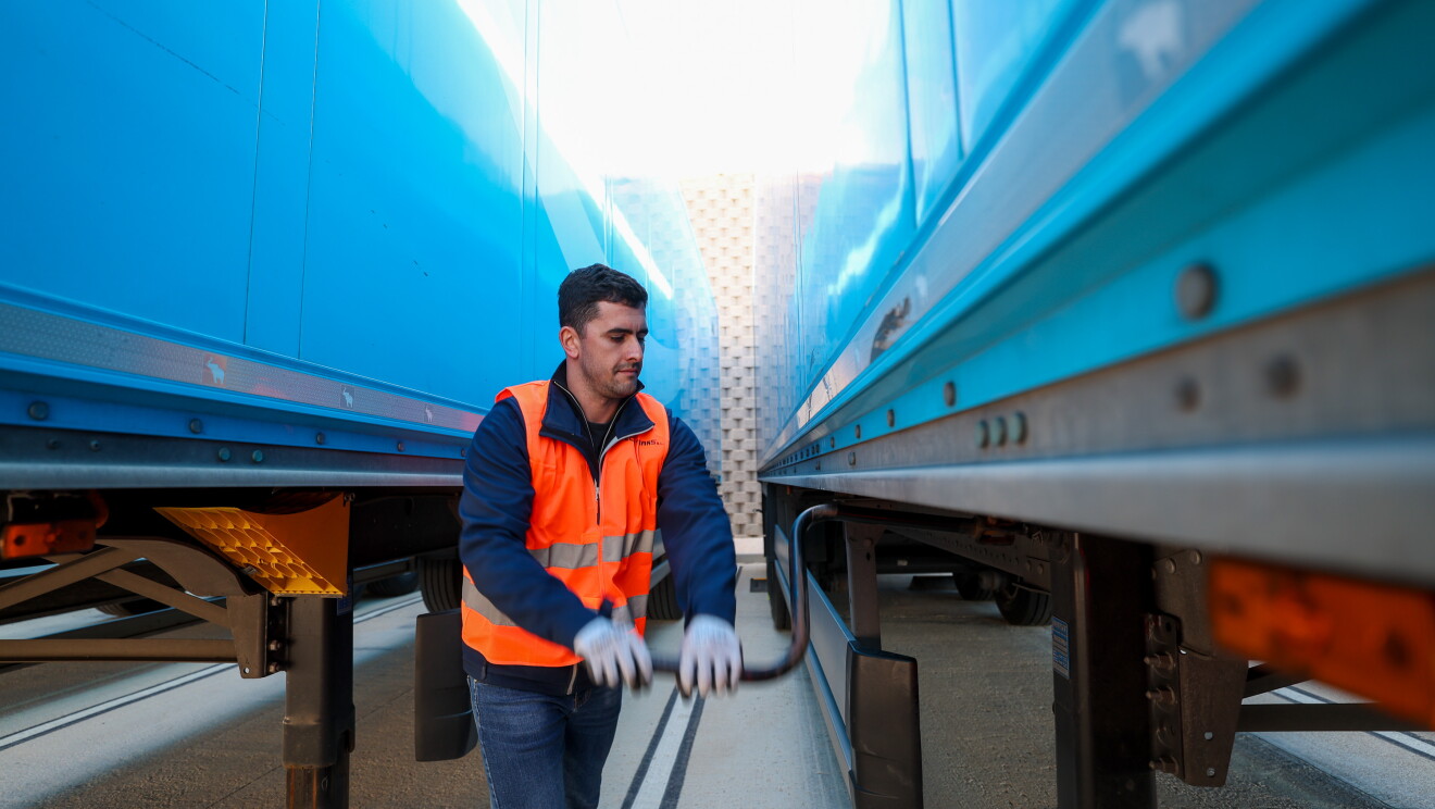 Relay Ecotrans worker winds crack on electric truck.jpg