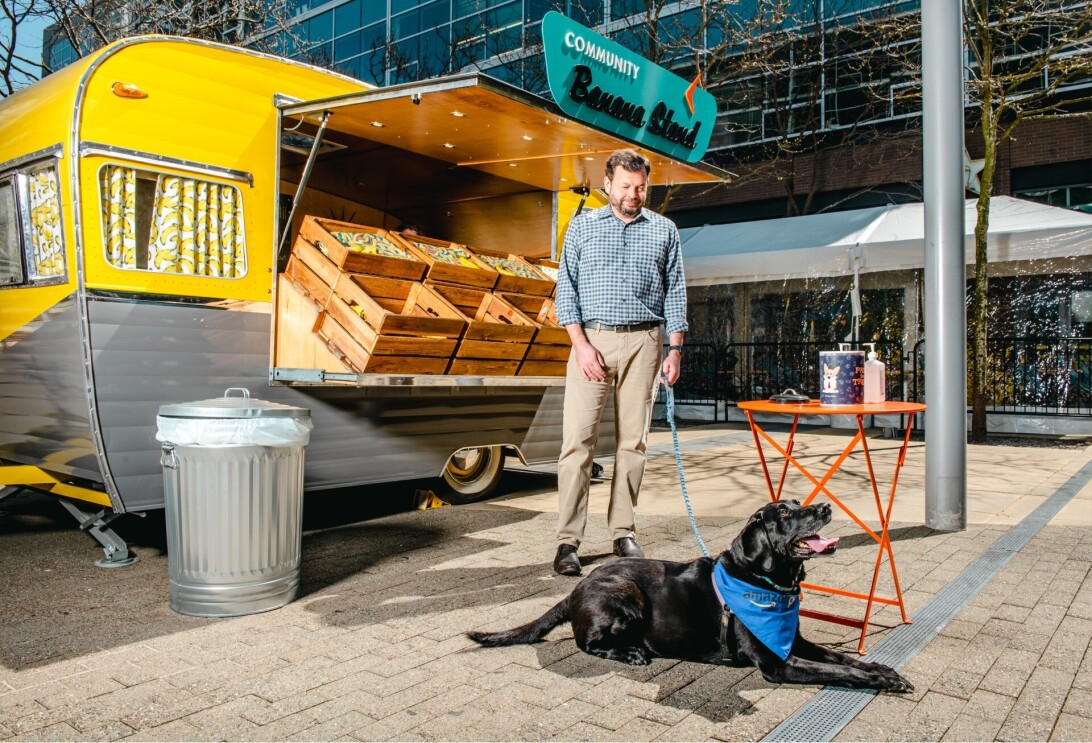 Chris and Sadie hang outside by the banana stand at Amazon's headquarters.