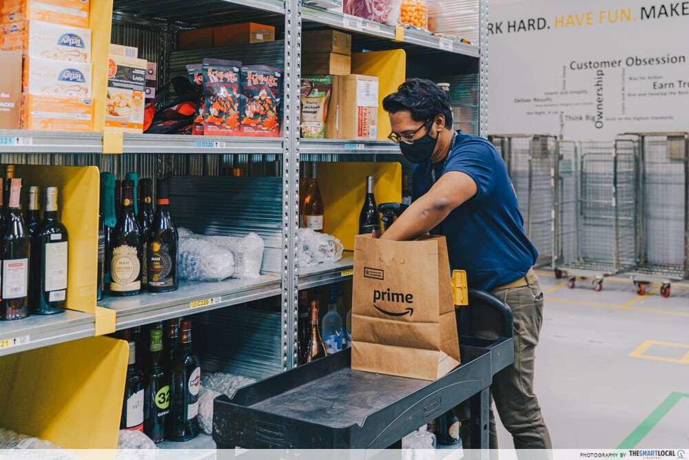 An employee packing an Amazon Fresh order in the fullfilment centre in Singapore