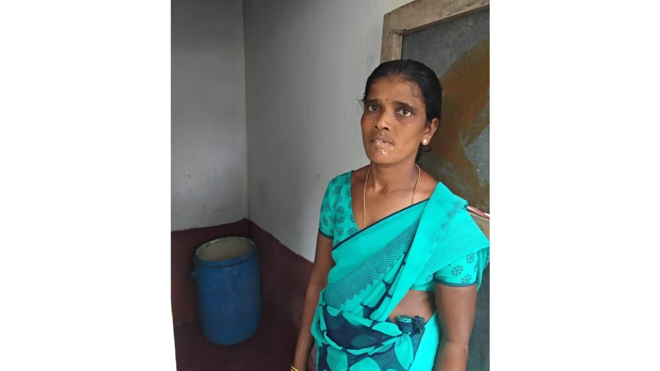 An image of a woman standing for a photo.