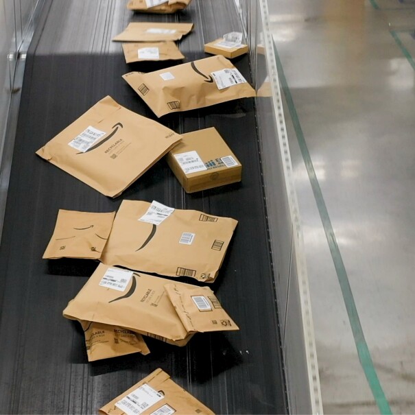 Packages on conveyor belt in warehouse