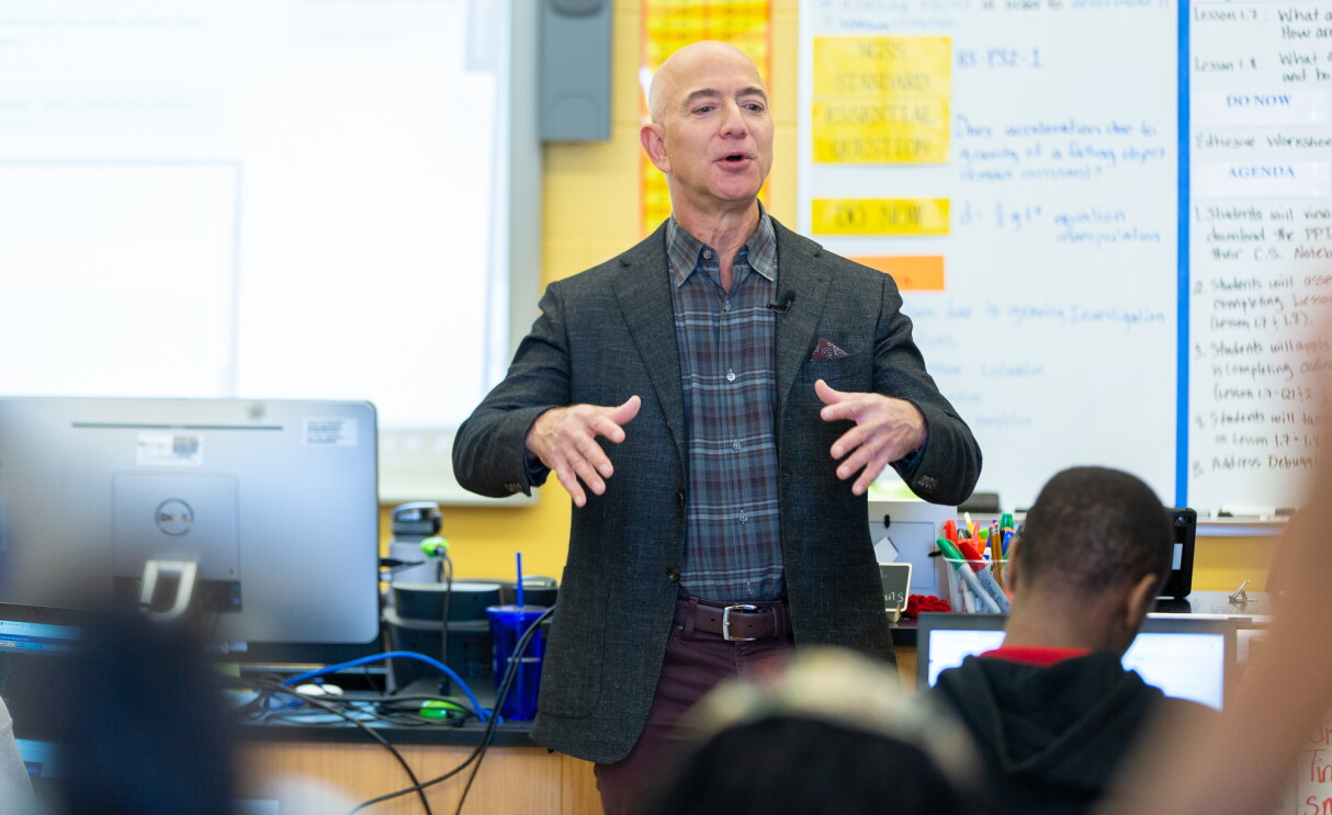 Amazon employee volunteers work on coding projects with students at Dunbar High School in Washington, DC to celebrate Amazon Future Engineer's 2,000 high schools milestone.