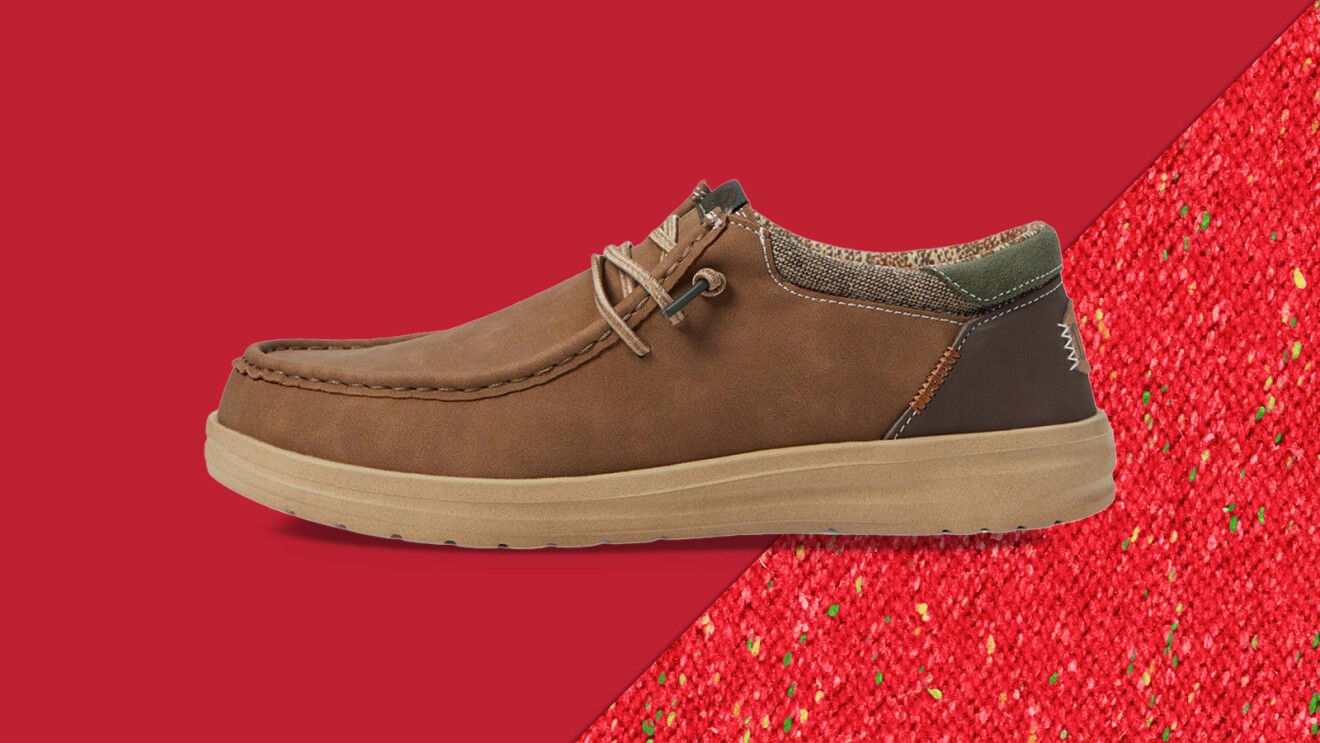 Brown casual shoe on red background with textured fabric