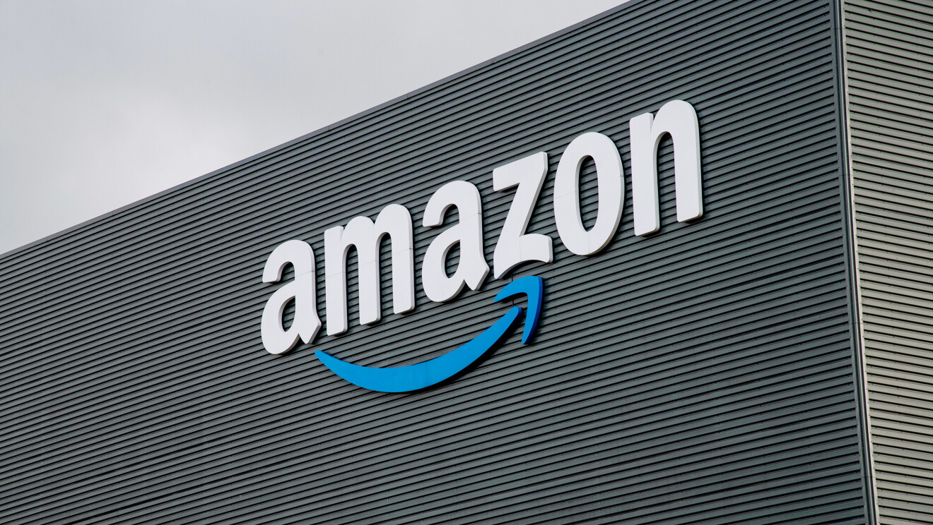 Blue Amazon logo at front of warehouse