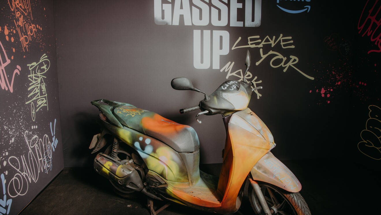 An immersive UV photo room with a motorcycle in the middle