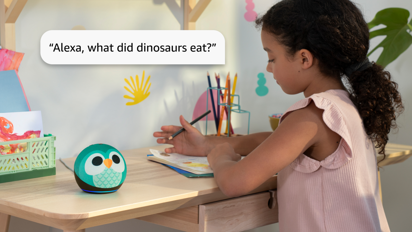 A child sitting at a desk, holding a coloring pencil and pad of paper, asking an Alexa dot, "Alexa, what did dinosaurs eat?"