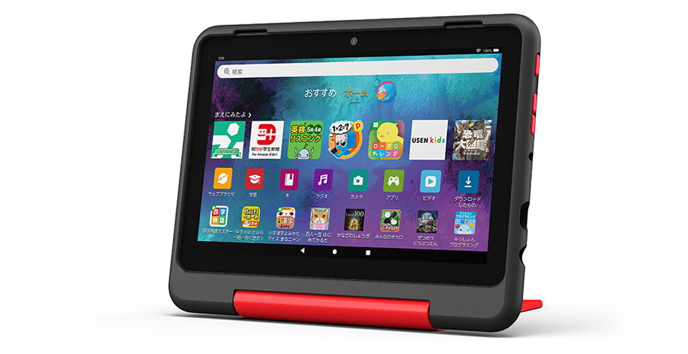 斜めから見たタブレットの製品画像。黒いフレームで、画面には子供の学習用アプリのアイコンが多数表示されている。