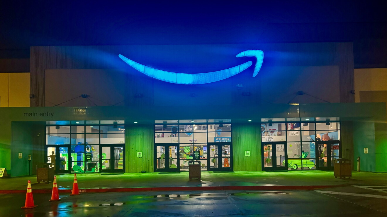 Operation Green Light at HQ2: Brilliantly lit Amazon retail location with distinctive blue swoosh logo