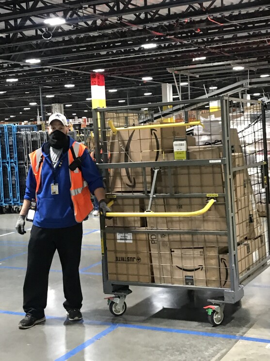 Amazon employee working at a fulfillment center