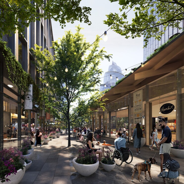 A rendering of the new Amazon headquarters in Arlington. The rendering shows people dining and shopping in a retail space at the headquarters.