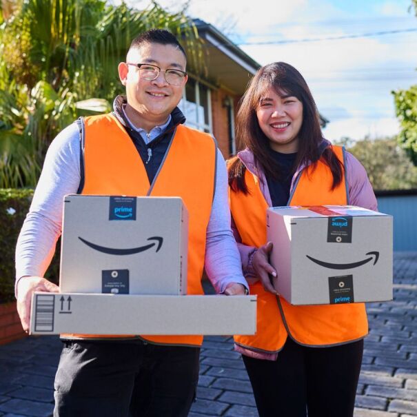 Amazon Flex drivers Chris and Joan Tan holding Amazon packages for delivery.