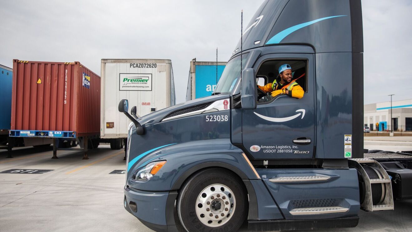 portraits and environmental photos of abel tuyisenge, a transportation operations management associate at amazon, as he drives and inspects trucks