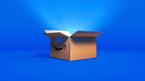 Amazon delivery box open on bright blue background