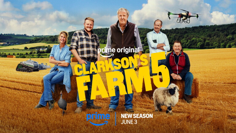 Jeremy Clarkson and the cast pose with a farming background
