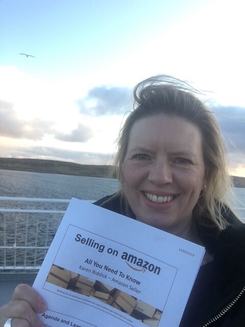 Karen Riddick holding booklet on Selling on Amazon