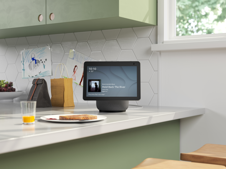 An image of an Alexa Show sitting on a kitchen counter top.