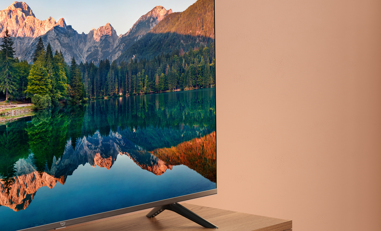 Fire TV 4 Series displaying a lake and mountain range scene.