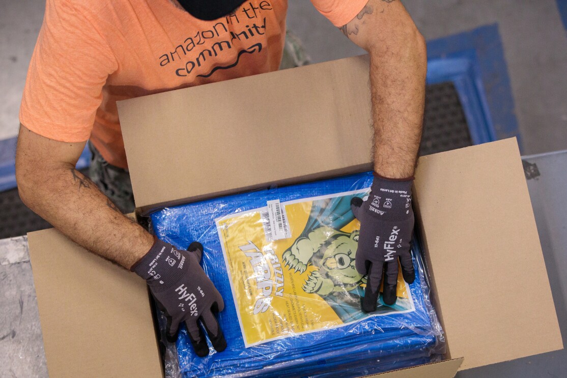 Amazon associates prepare items to distribute in the aftermath of Hurricane Dorian.