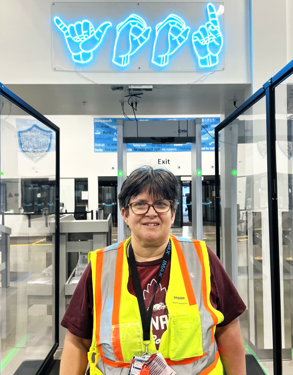 An image of Susan Meadows in an Amazon fulfillment center. 