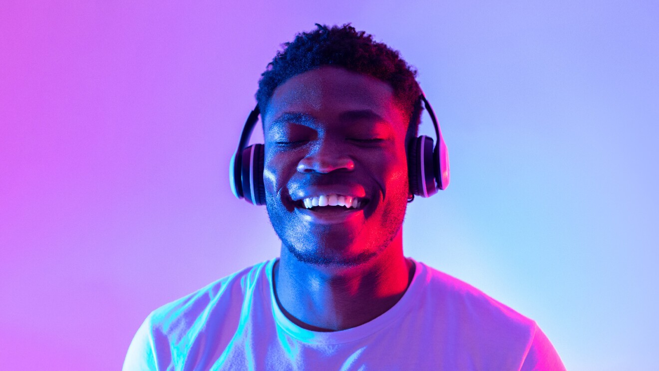 Prime Day 2023 live blog best deals: man listening to music with headphones.