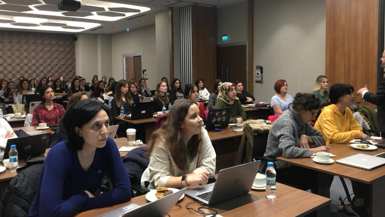 Turkish women carefully listening to the presentations