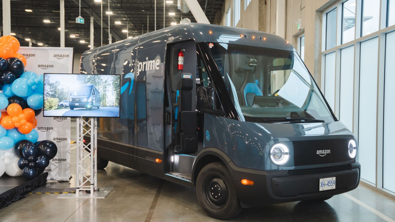 Image of a Amazon x Rivian delivery van beside balloons