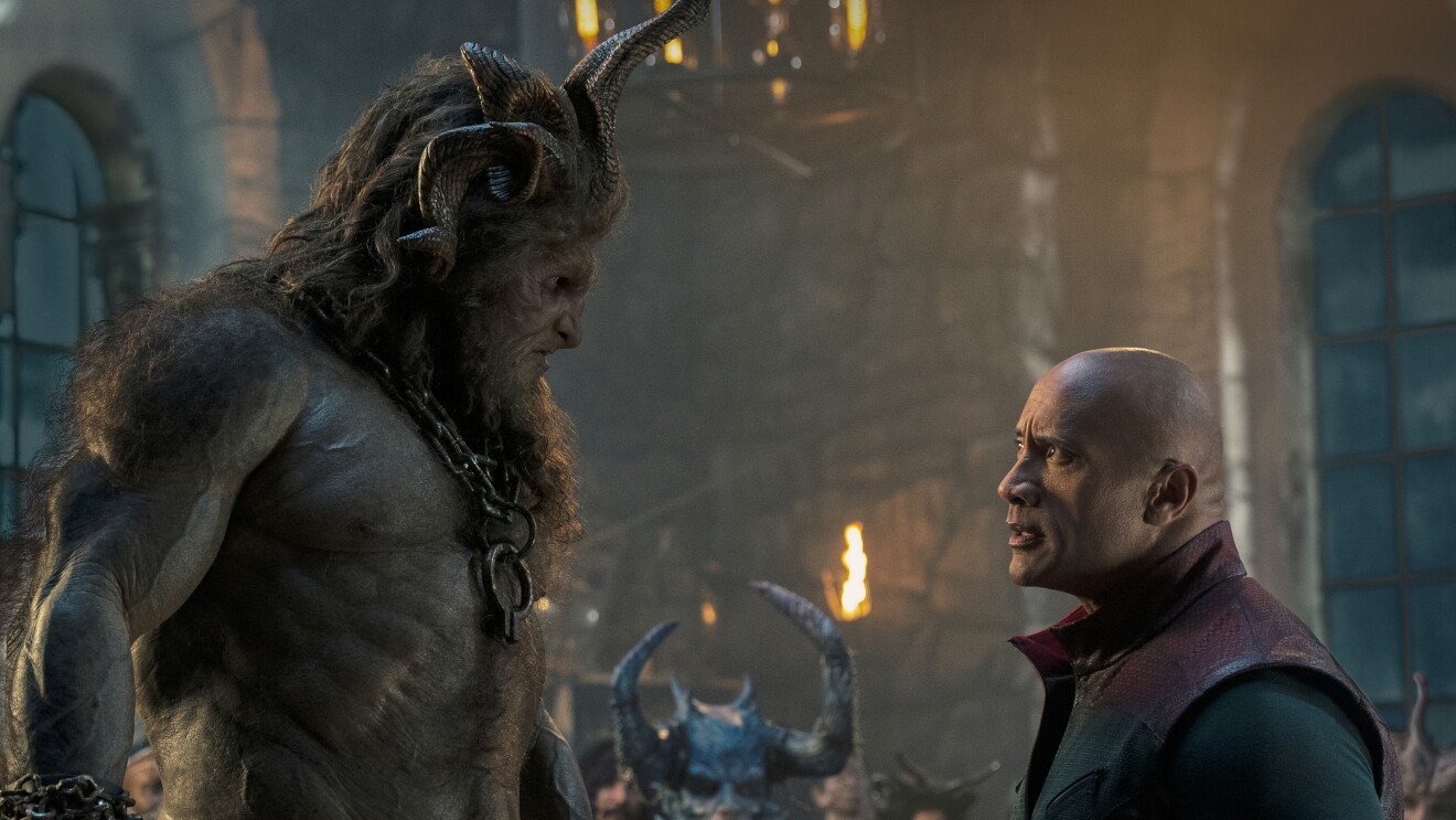 Red One: Monstrous creature towers over human in atmospheric fantasy scene