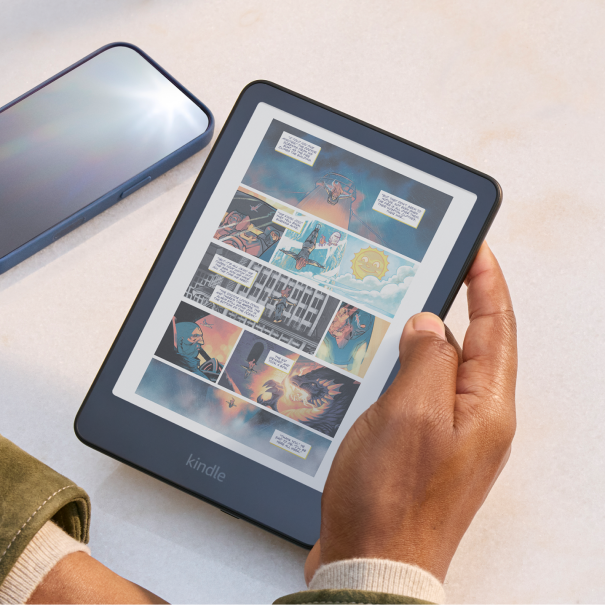 A man reading a colour comic book on a Kindle Colorsoft