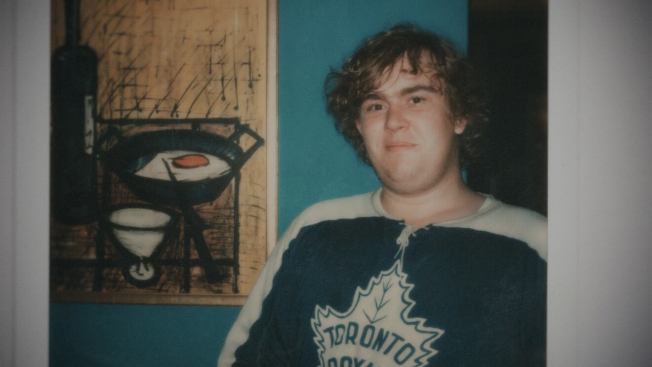 An image of young John Candy wearing a Toronto Maple Leafs jersey