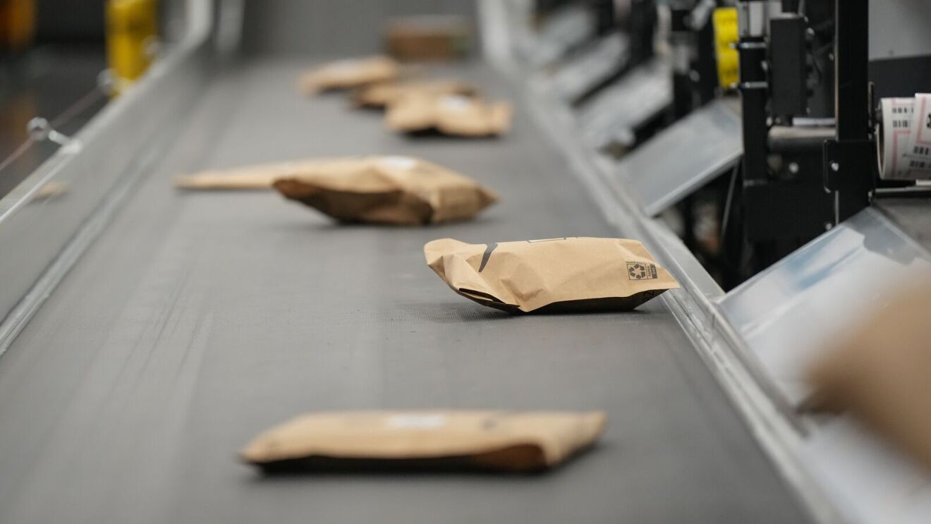 Brown paper bags on assembly line