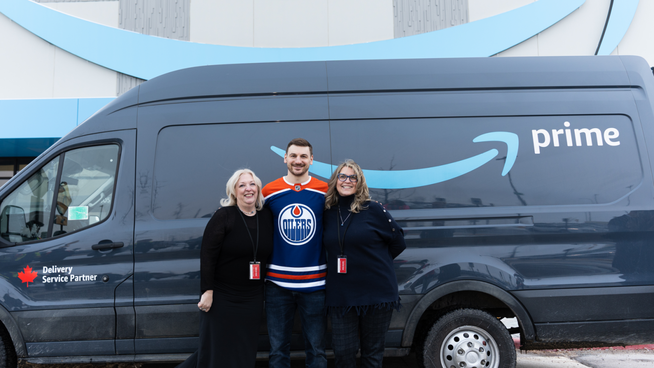 hockey player helping package boxes 