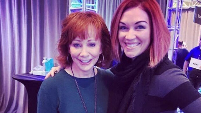 MTK smiles for a photo with Reba McEntire.