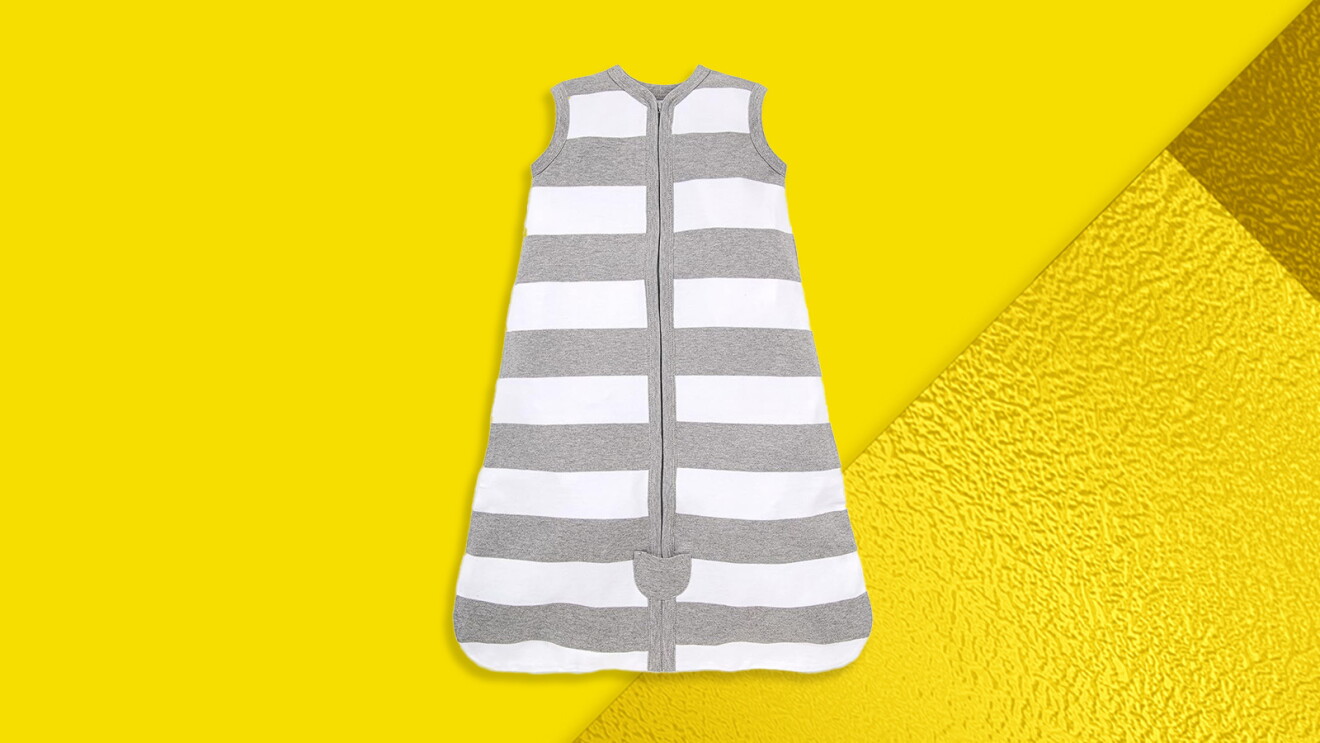 Gray and white striped sleep sack for infants on yellow background