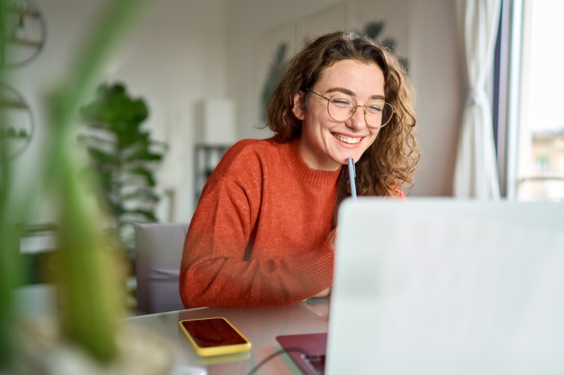 Girl on Laptop Applying for Grant