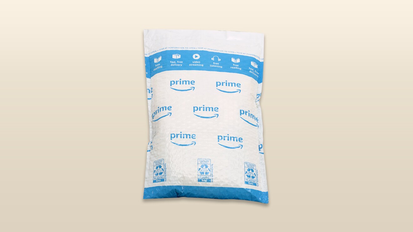 An image of an amazon package with a beige background.